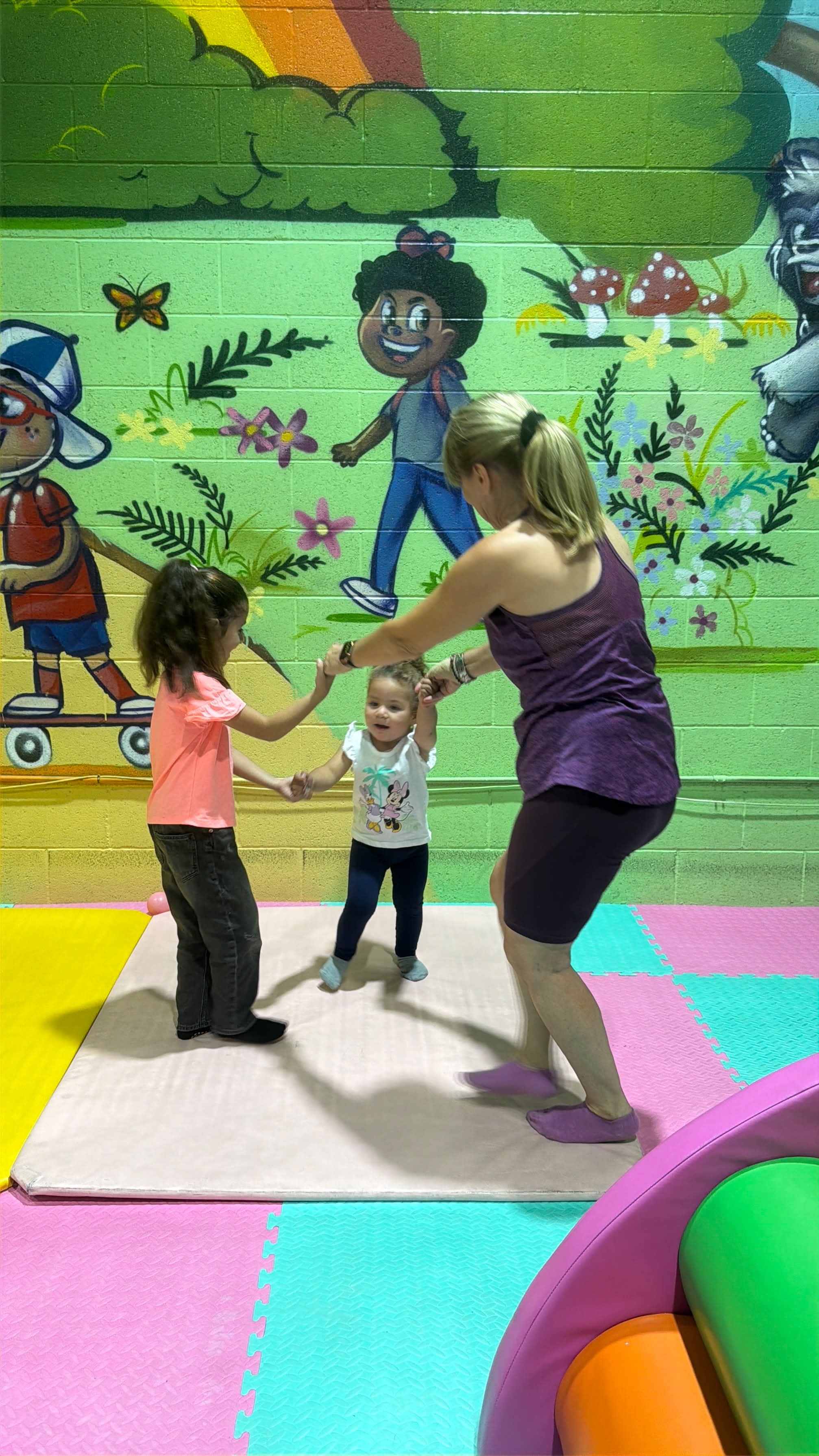Children explore an activity in a welcoming class environment.