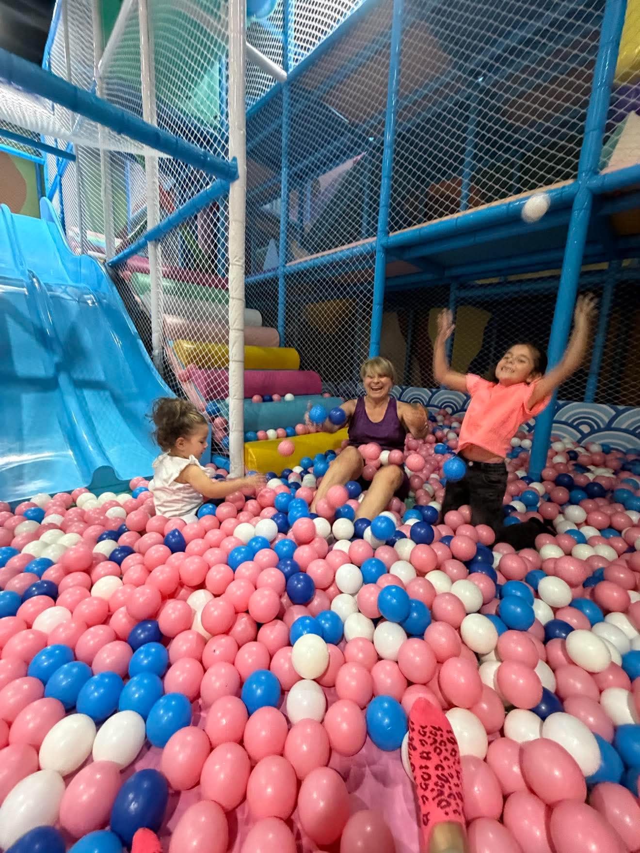 A child participates in a class activity with the support that suits them.