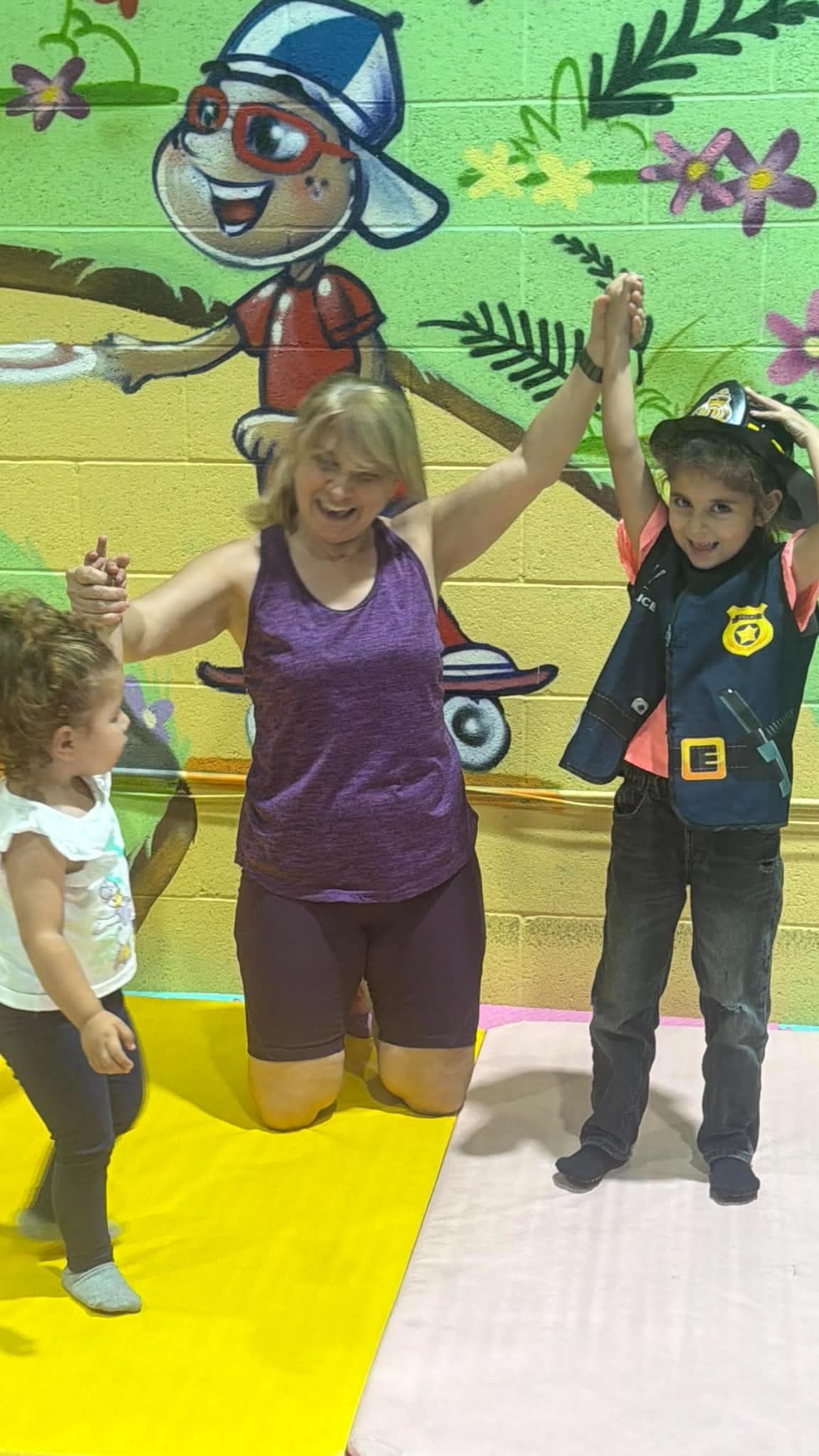 A playful class moment with children exploring movement together.